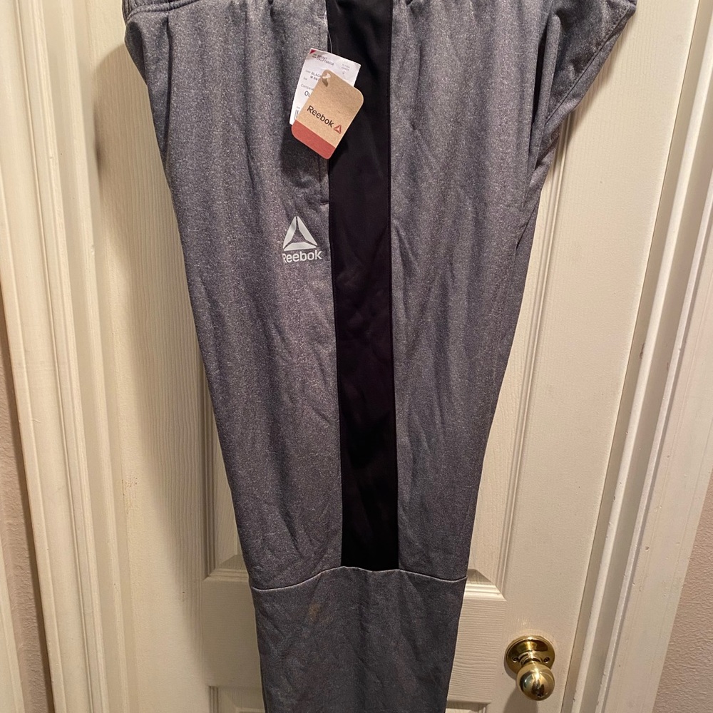 REEBOK Men’s Big & Tall Athletic Pants. Heather grey with black stripe.